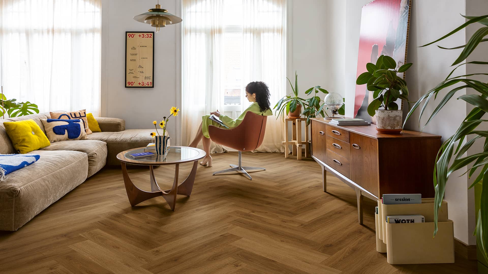 Living room with dark brown vinyl herringbone flooring